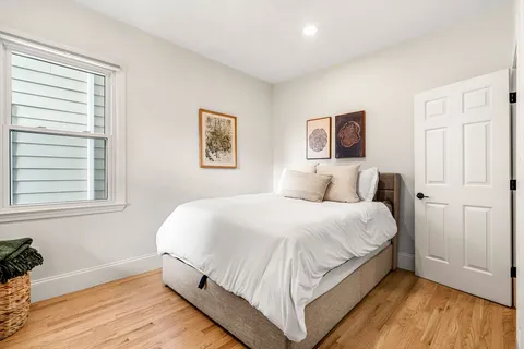 a bathroom with a granite countertop shower a sink and a mirror