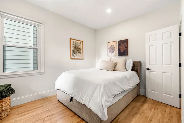 a bathroom with a granite countertop shower a sink and a mirror