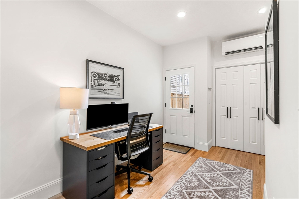 7 O Street, Unit 1 Boston, MA 02127 - Photo 10 of 15 a workspace with furniture and wooden floor
