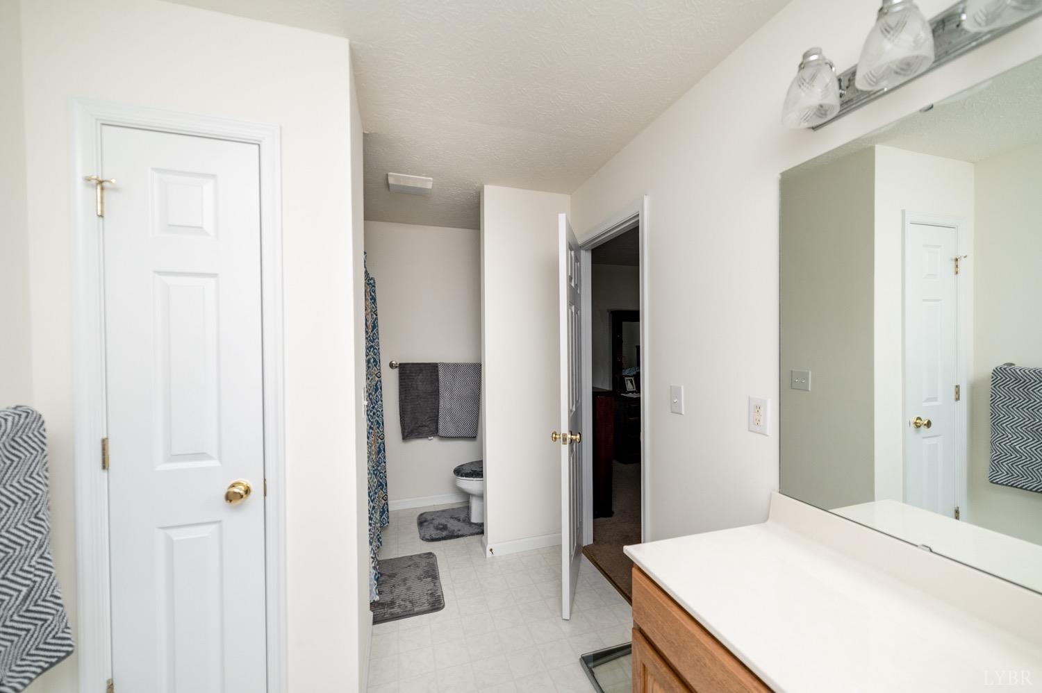312 Longhill Road Goode, VA 24556 - Photo 50 of 56 a bedroom with a bed and a table