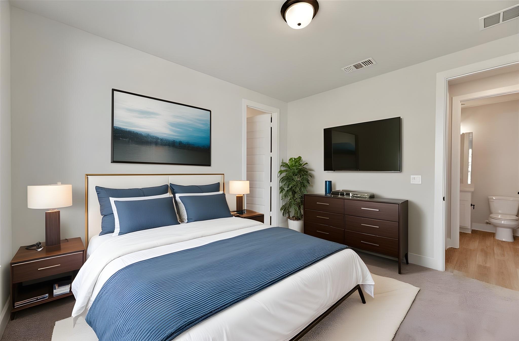 1545 Rodeo Ridge Drive Georgetown, TX 78628 - Photo 19 of 33 Bedroom featuring light colored carpet and ensuite bath