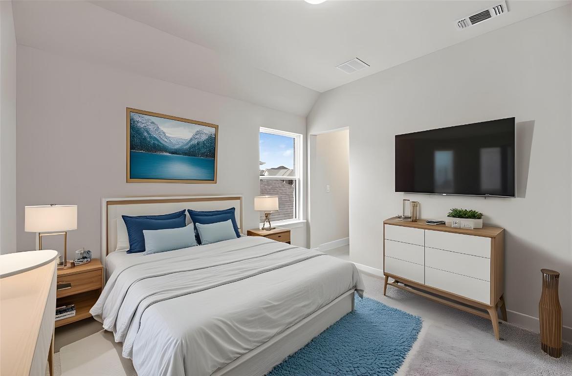 1545 Rodeo Ridge Drive Georgetown, TX 78628 - Photo 21 of 33 Bedroom with light colored carpet and vaulted ceiling