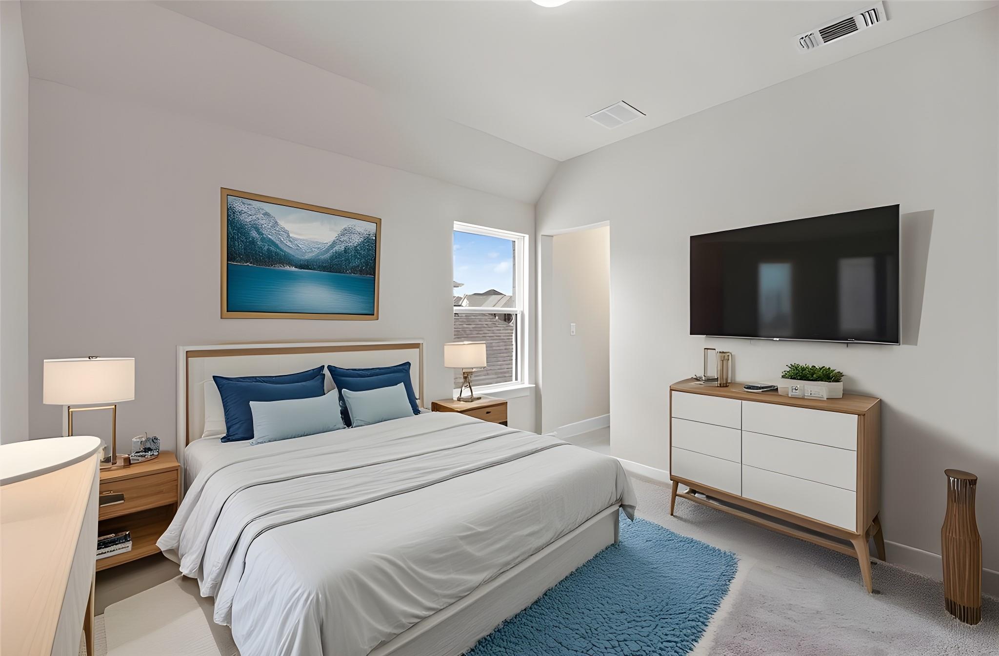 1545 Rodeo Ridge Drive Georgetown, TX 78628 - Photo 21 of 33 Bedroom with light colored carpet and vaulted ceiling