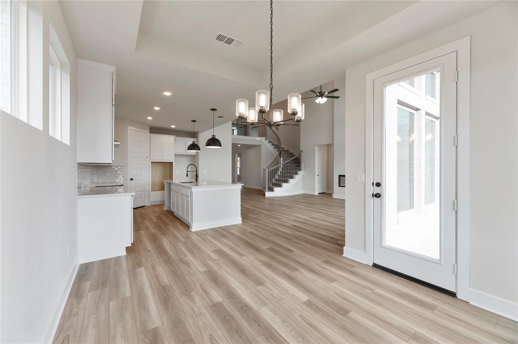 1545 Rodeo Ridge Drive Georgetown, TX 78628 - Photo 33 of 33 Kitchen with a chandelier, plenty of natural light, open floor plan, hanging light fixtures, and recessed lighting