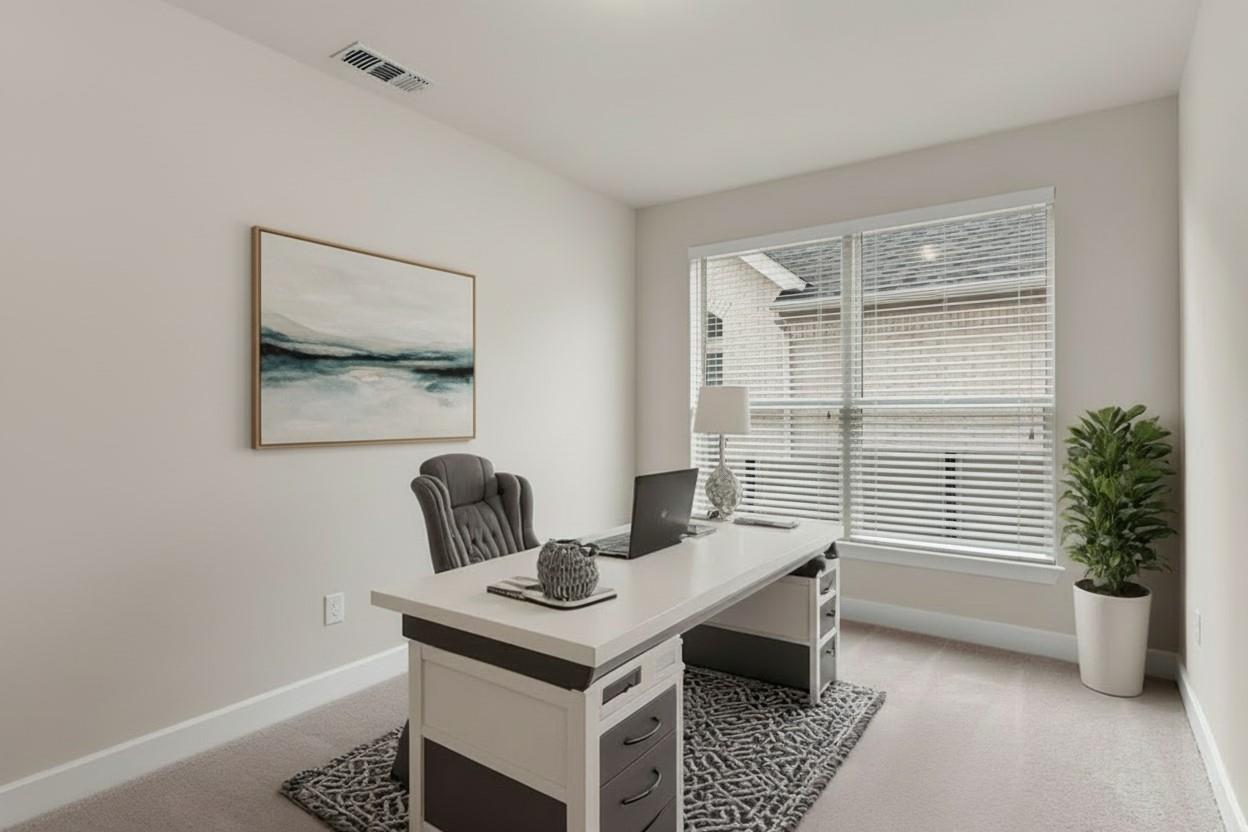 1545 Rodeo Ridge Drive Georgetown, TX 78628 - Photo 7 of 33 Office area with light carpet and baseboards