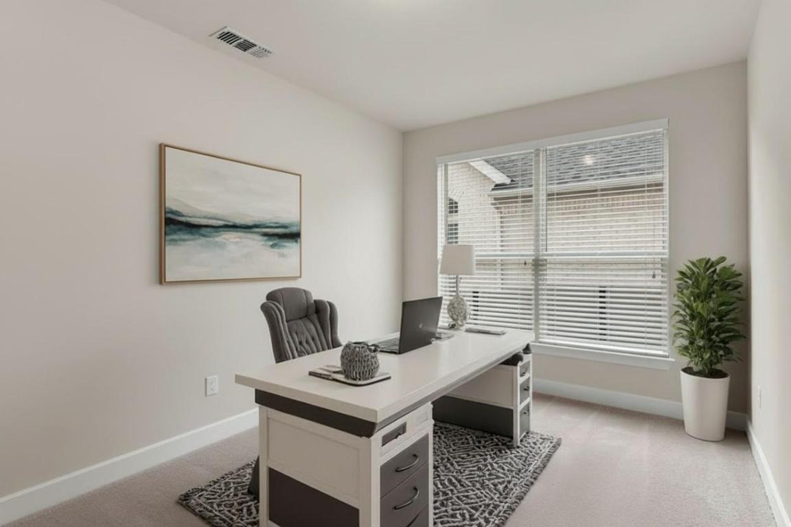 1545 Rodeo Ridge Drive Georgetown, TX 78628 - Photo 7 of 33 Office area with light carpet and baseboards