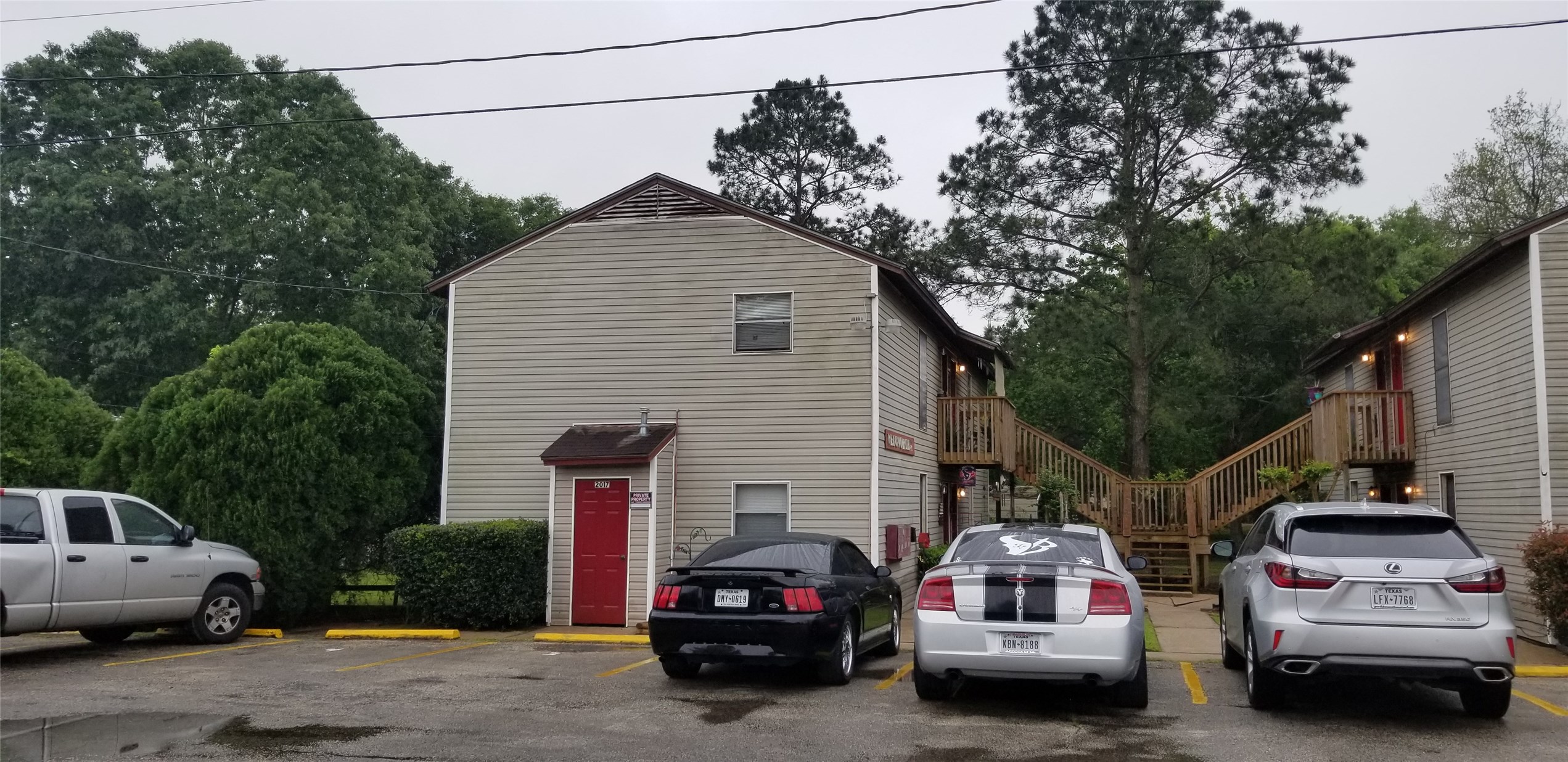 2017 West Sidnor Street, Unit 6 Alvin, TX 77511 - Photo 2 of 13 a car parked in front of a house