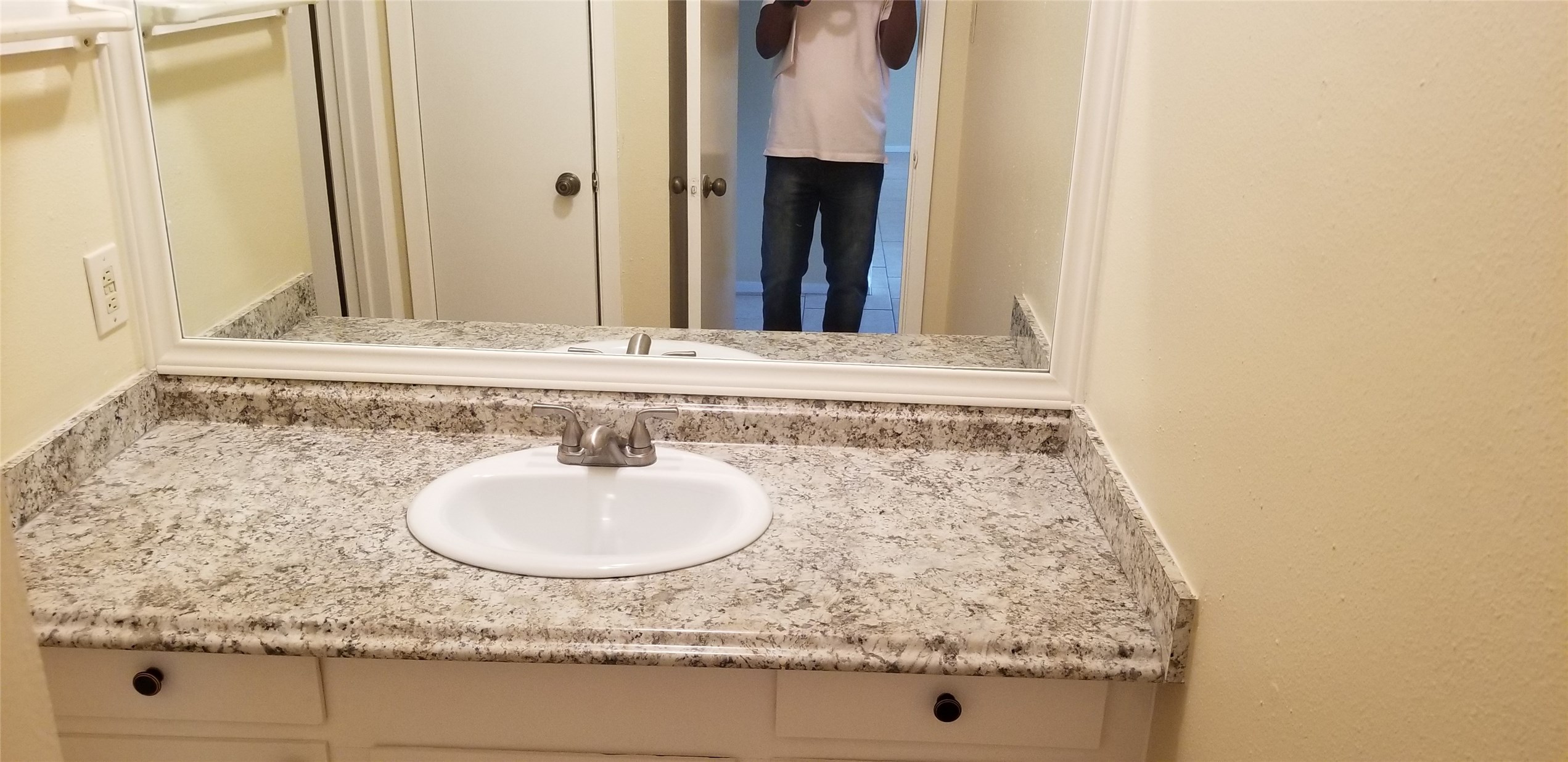 2017 West Sidnor Street, Unit 6 Alvin, TX 77511 - Photo 7 of 13 a bathroom with a granite countertop sink and a mirror