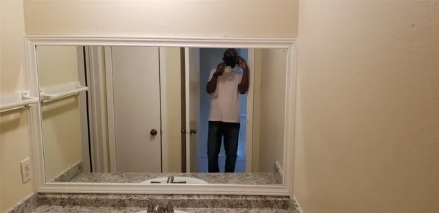 a kitchen with stainless steel appliances granite countertop a refrigerator and a stove