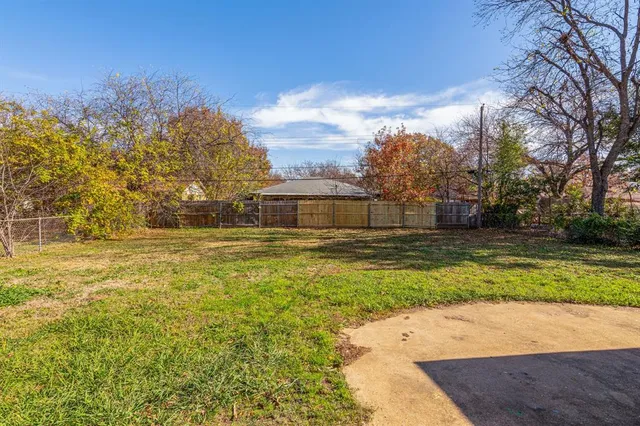 a swimming pool with trees in the background