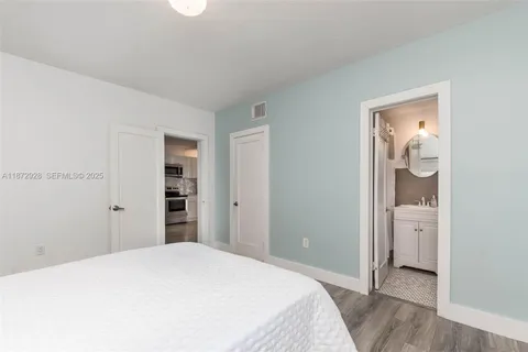 a bedroom with a bed and utility room