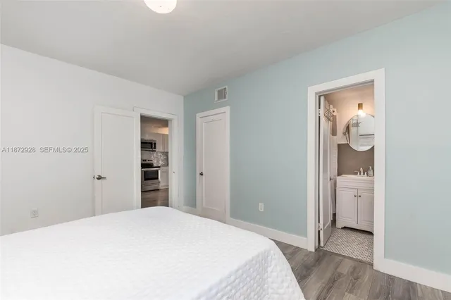 a bedroom with a bed and utility room