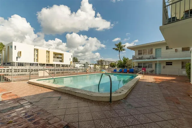 a view of a swimming pool and lounge chair