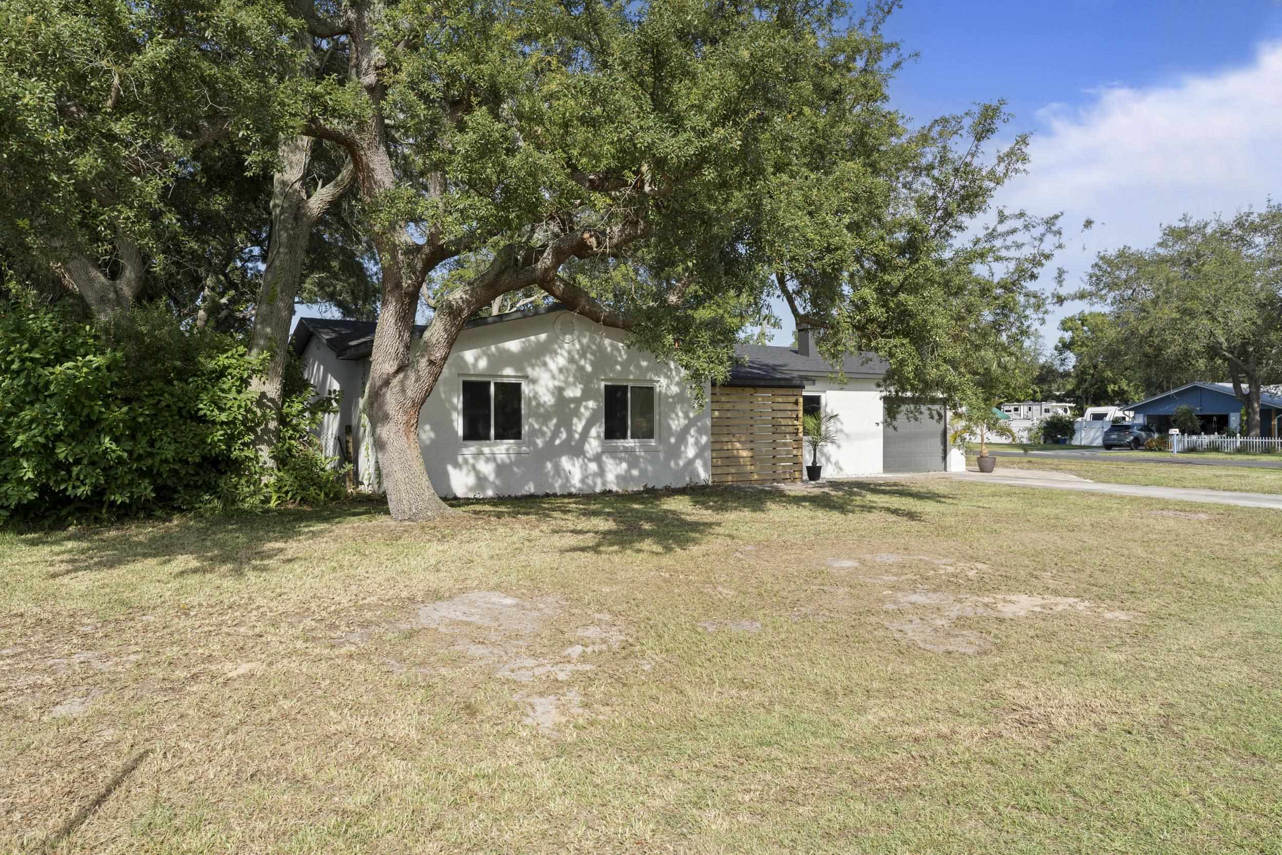447 Segovia Road St. Augustine, FL 32086 - Photo 3 of 47 a front view of a house with a yard