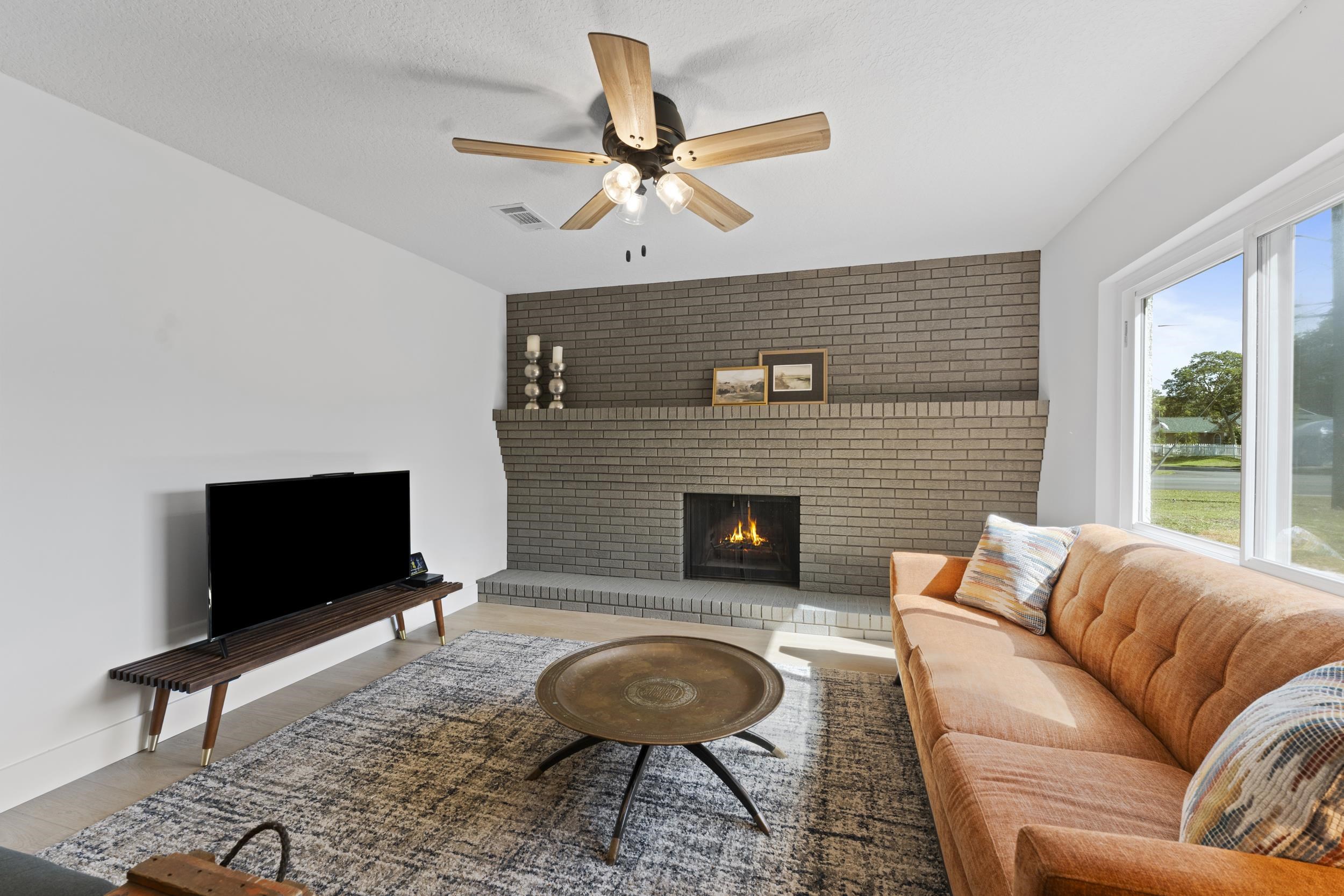 447 Segovia Road St. Augustine, FL 32086 - Photo 10 of 47 a living room with furniture a rug and a fireplace