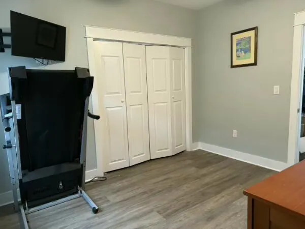 a view of an entryway with wooden floor