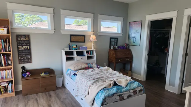 a bedroom with furniture and a window