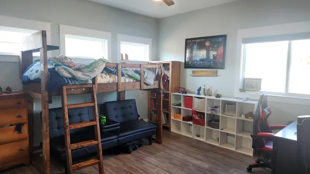 a bedroom with a bed and furniture