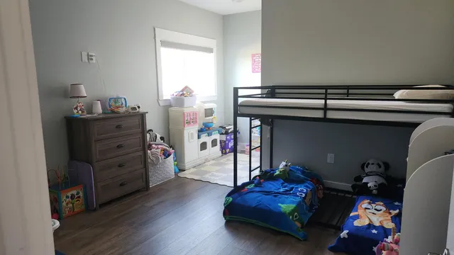a room with furniture and a bookshelf