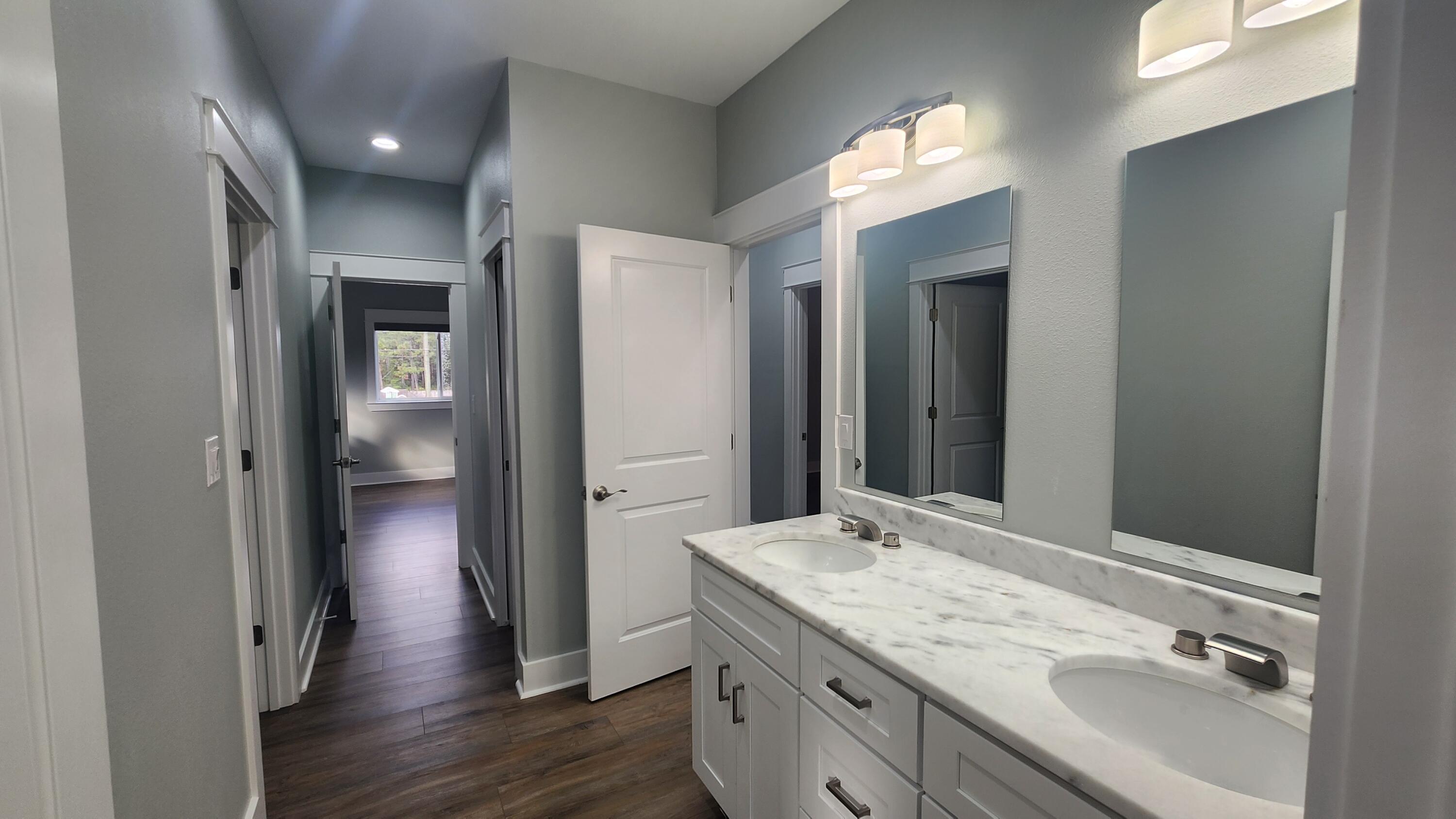 9149 Timber Lane Navarre, FL 32566 - Photo 20 of 44 a bathroom with a sink and a mirror