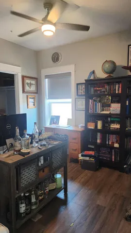 a bathroom with a sink a light fixture and a mirror