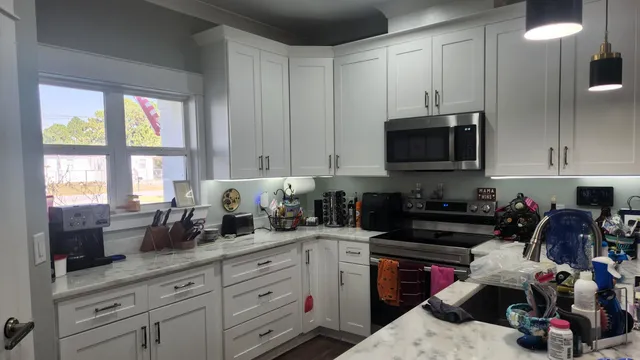 a kitchen with a sink and cabinets