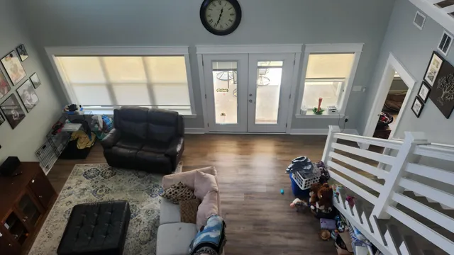 a view of an entryway with wooden floor