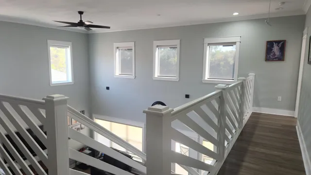 a front view of a house with yard and porch