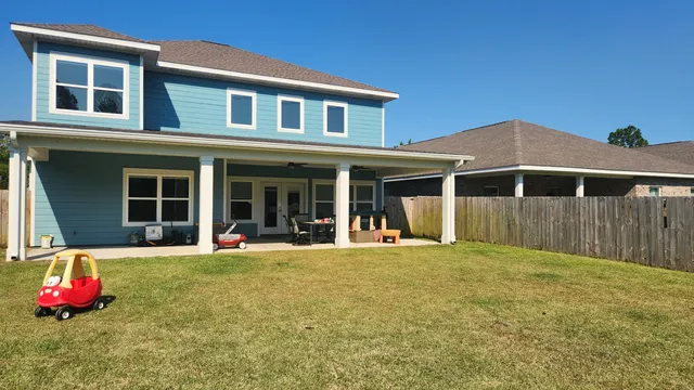 a swimming pool with wooden fence