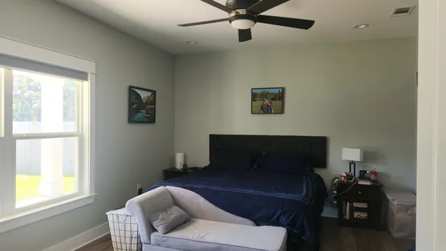 a view of room with window and cabinet