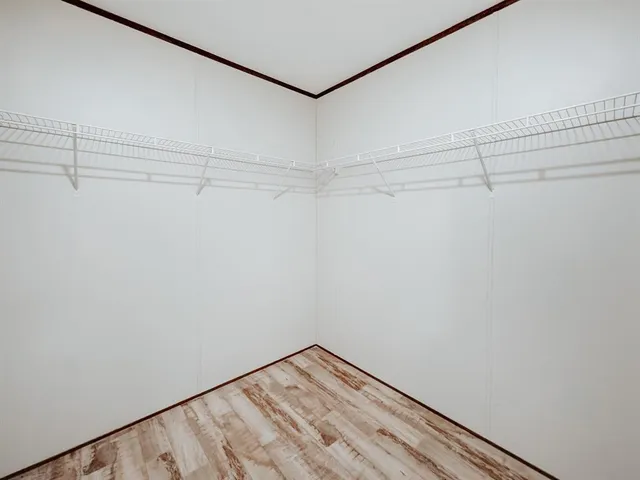 a view of a room with racks on the wall