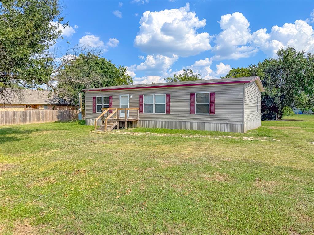 103 North 7th Street Dawson, TX 76639 - Photo 18 of 19 a house view with swimming pool and garden space