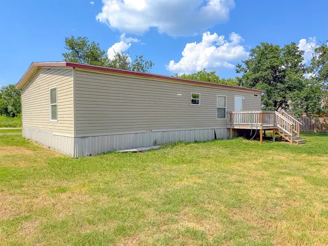 a view of a backyard with a garden