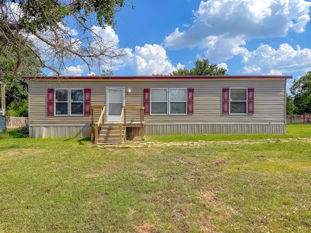 a front view of house with yard