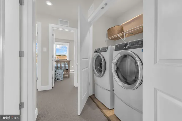 a bathroom with a sink toilet and a mirror