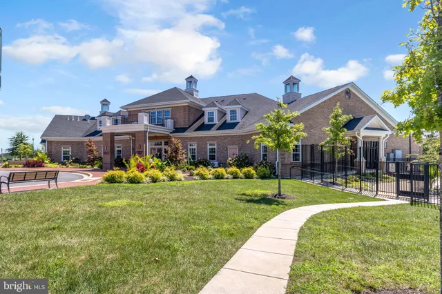 a view of a house with a yard porch and sitting area