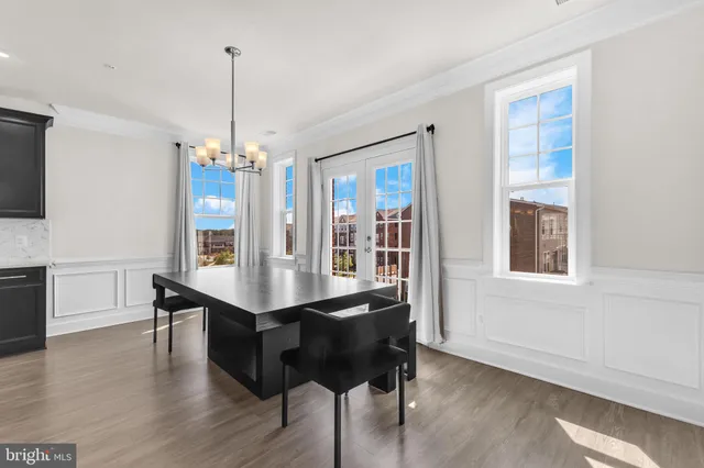 a view of a room with furniture and wooden floor