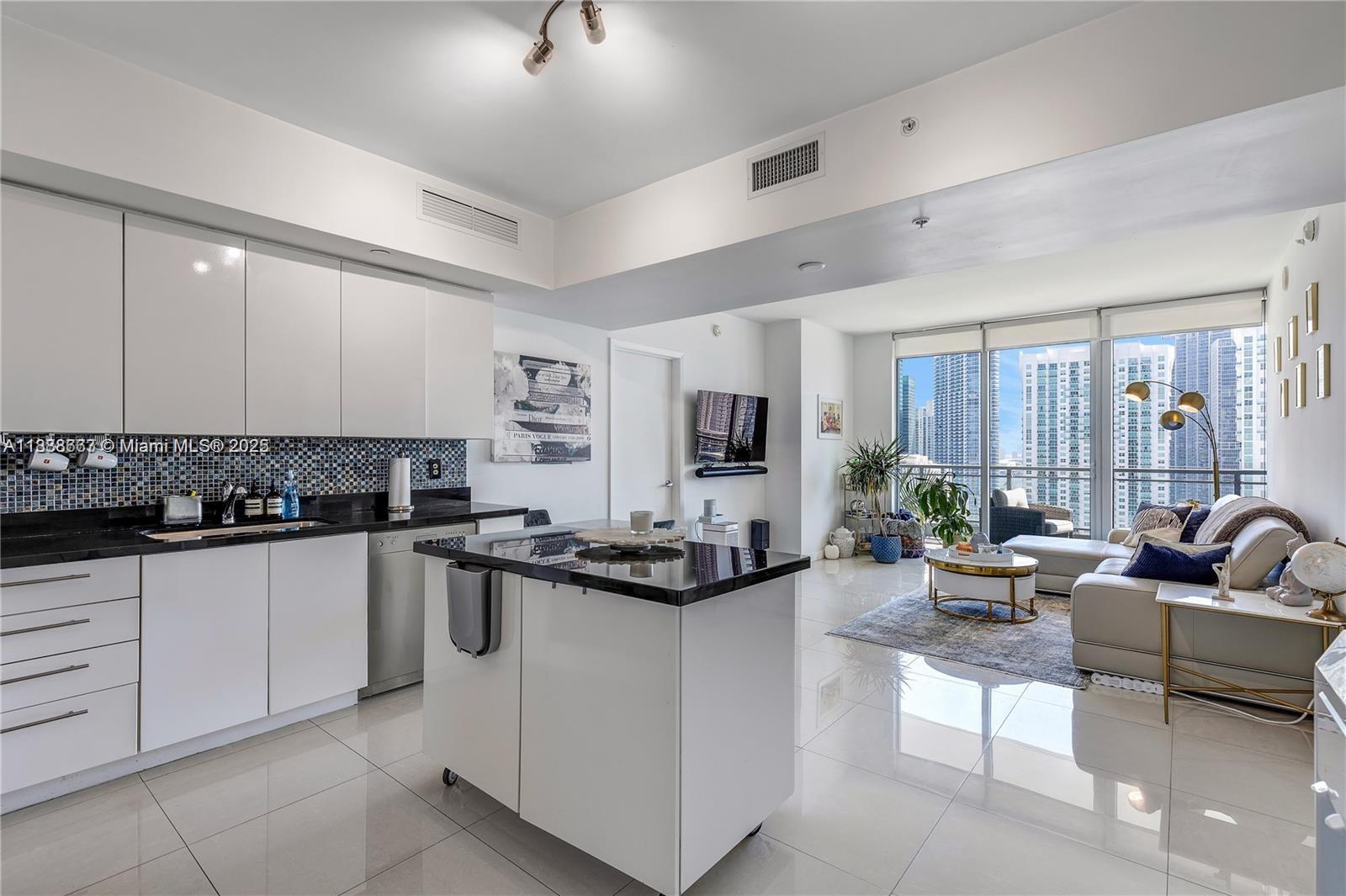 92 Southwest 3rd Street, Unit 3012 Miami, FL 33130 - Photo 4 of 18 a kitchen with sink stove and cabinets