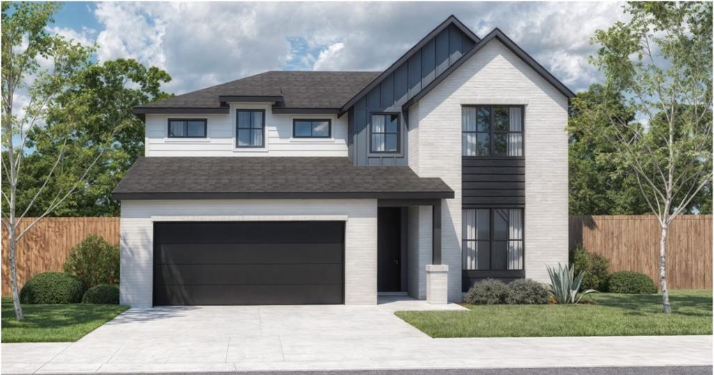 a front view of a house with garage
