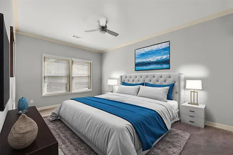 a bedroom with bed and window