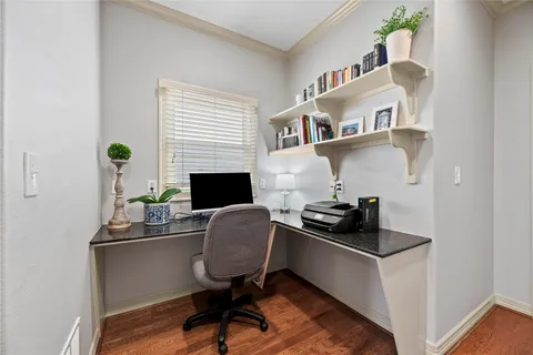 a work room with furniture and wooden floor