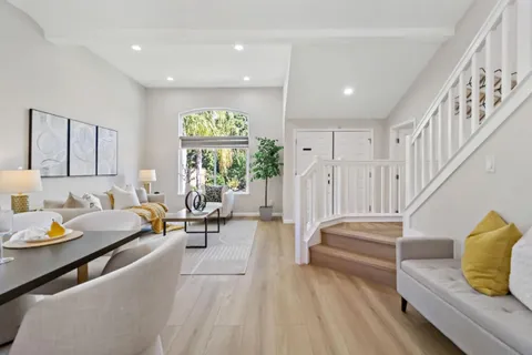 a living room with furniture and a lamp