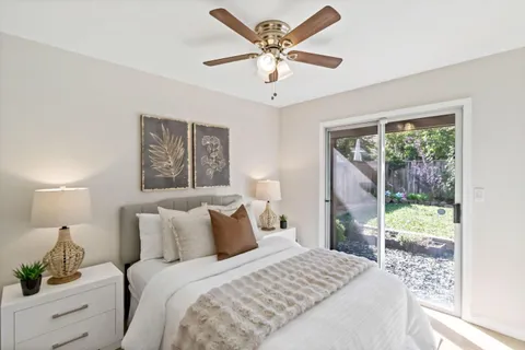 a bedroom with a large bed and a window