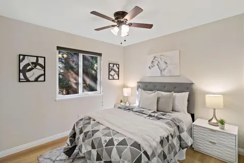 a bedroom with a bed and a lamp