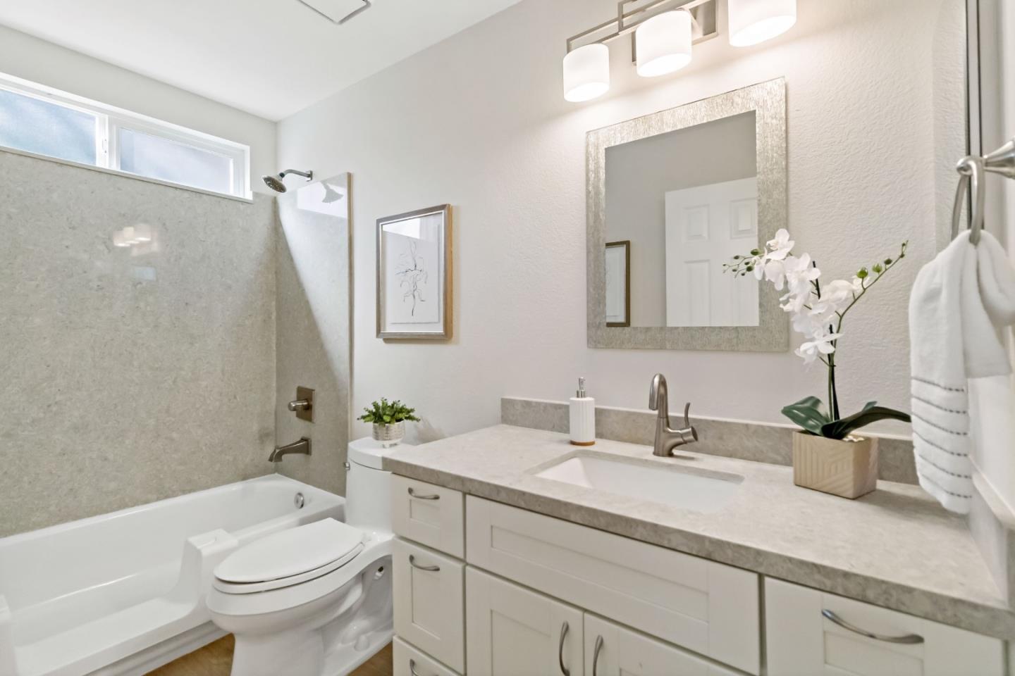 4593 Fallstone Court San Jose, CA 95124 - Photo 36 of 59 a bathroom with a sink a toilet and a mirror