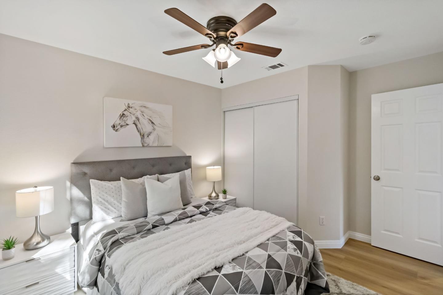 4593 Fallstone Court San Jose, CA 95124 - Photo 38 of 59 a bedroom with a bed and a chandelier