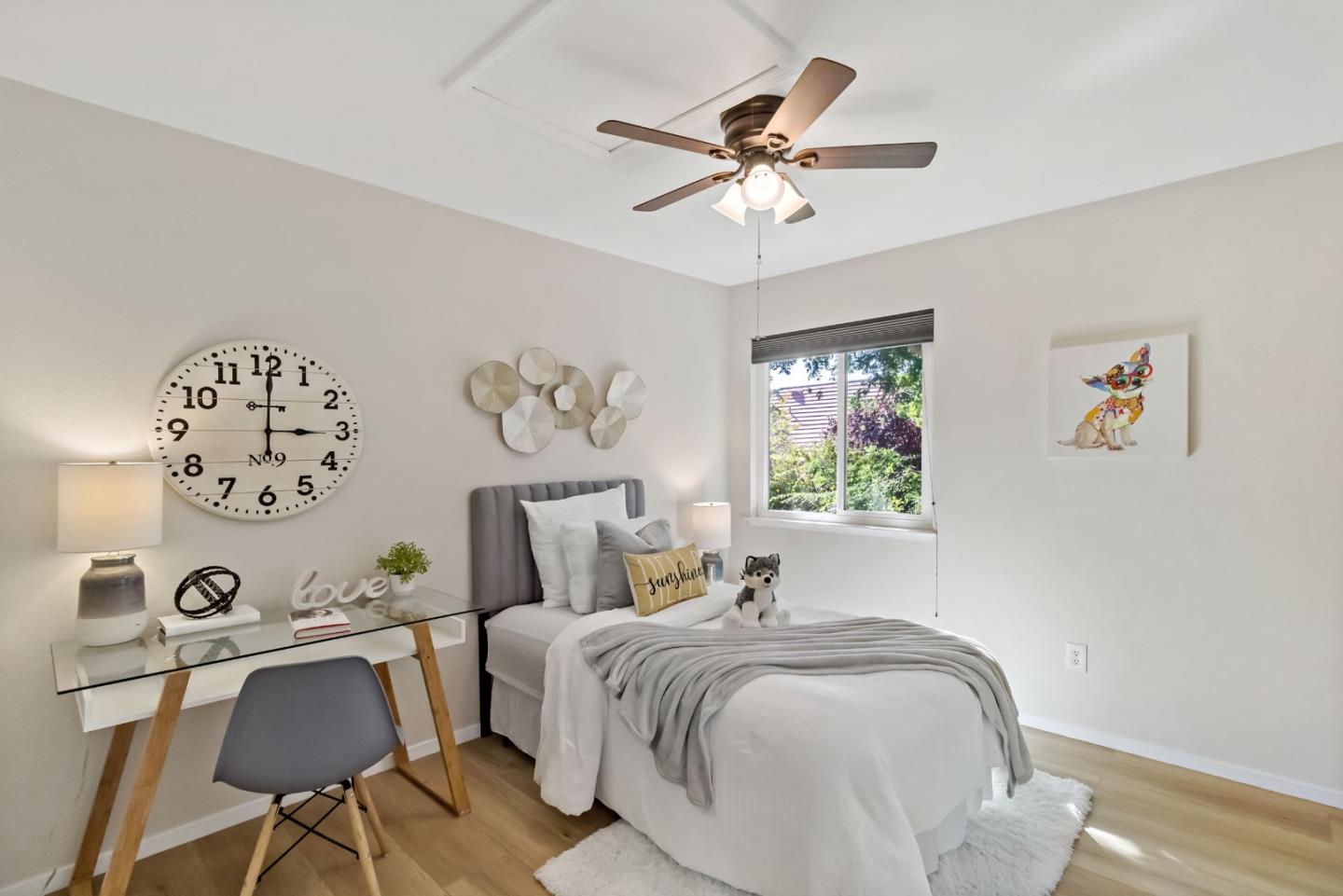 4593 Fallstone Court San Jose, CA 95124 - Photo 40 of 59 a bedroom with a bed and a chandelier