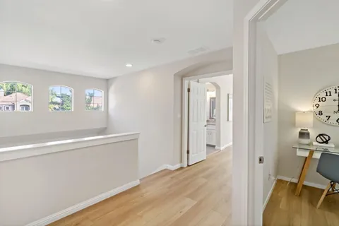a view of livingroom with hardwood floor and hallway