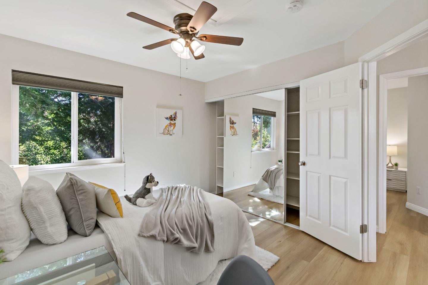 4593 Fallstone Court San Jose, CA 95124 - Photo 42 of 59 a bed room with a bed and a chandelier