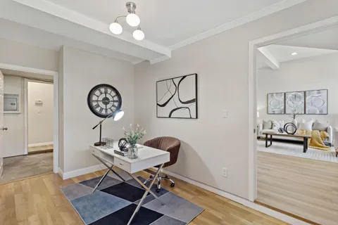 a front view of a house with garden and patio